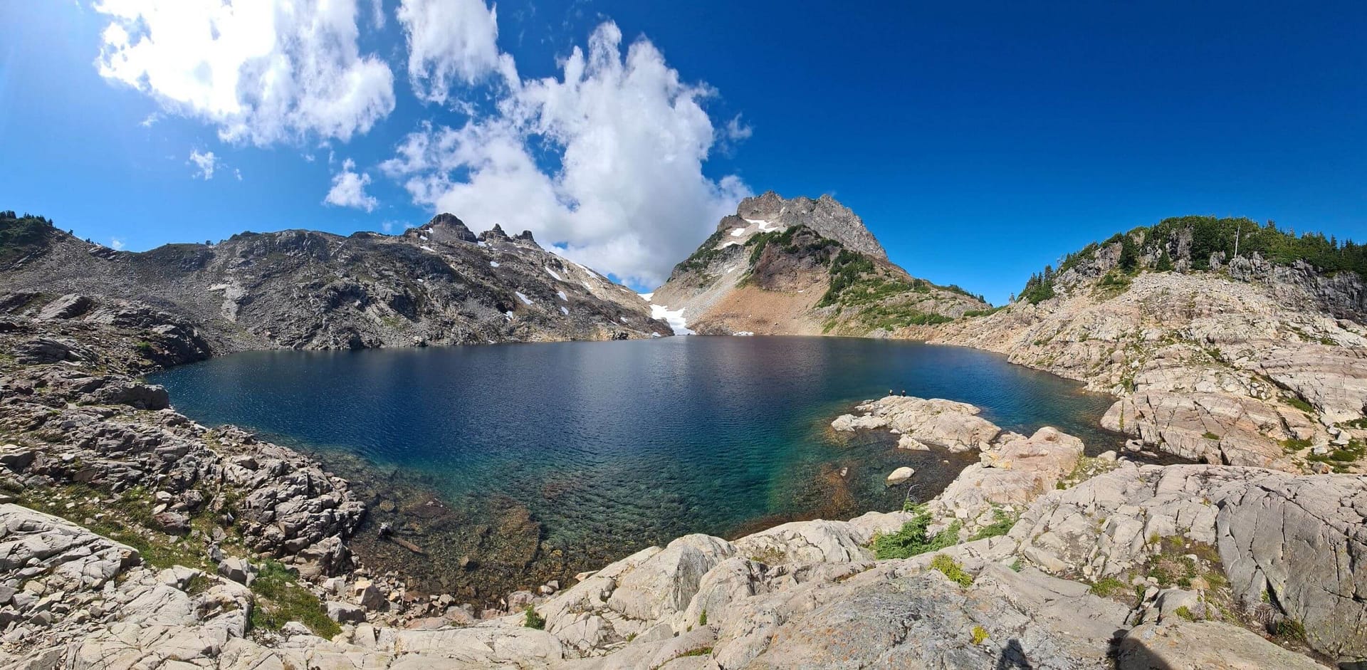 a panoramic view of Foggy lake just outside Gothic Basin