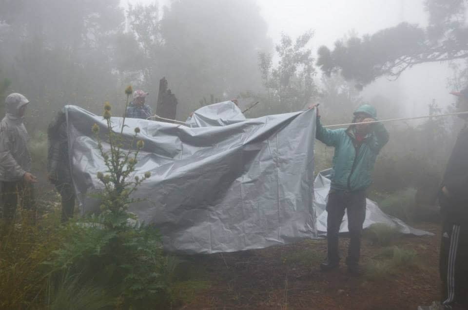 Setting up the tarp for a tent at Acatenango Volcano