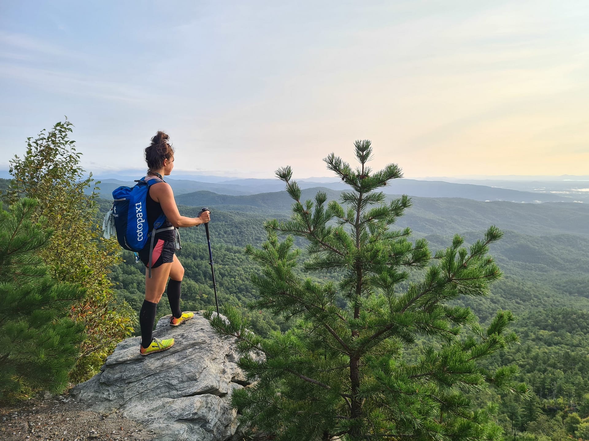 Girl overlooking linville gorge at sunrise
